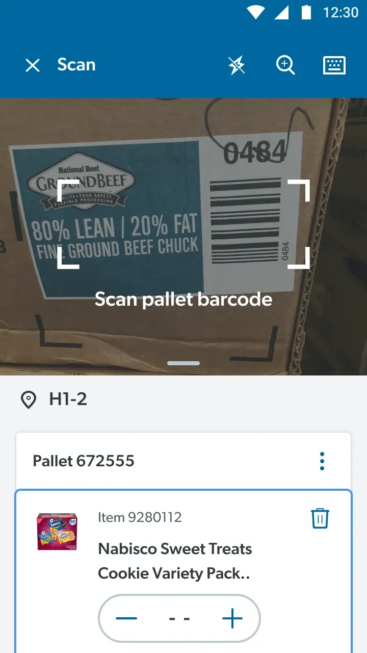 Scan screen: the camera framing a pallet barcode on a ground beef case, above the pallet’s item list.
